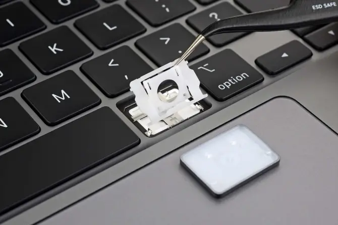 Remove both the keycap and the scissor-switch mechanism before cleaning
