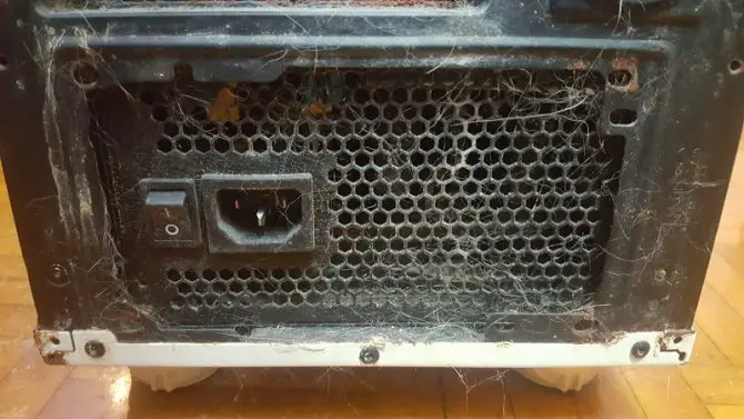 Back of PC tower with unplugged power cord